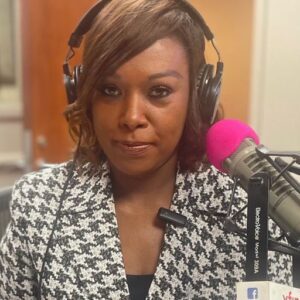 Dr. Sonya Whitaker with a mic and headphones